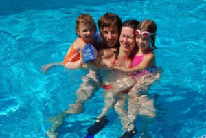 family in pool